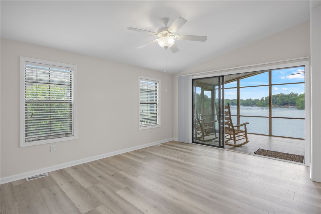 1230 Melton Road, Unit 25 West Union, SC 29696 - Photo 32 of 46 Lake views abound from this versatile room with vaulted ceilings and direct screened porch access.
