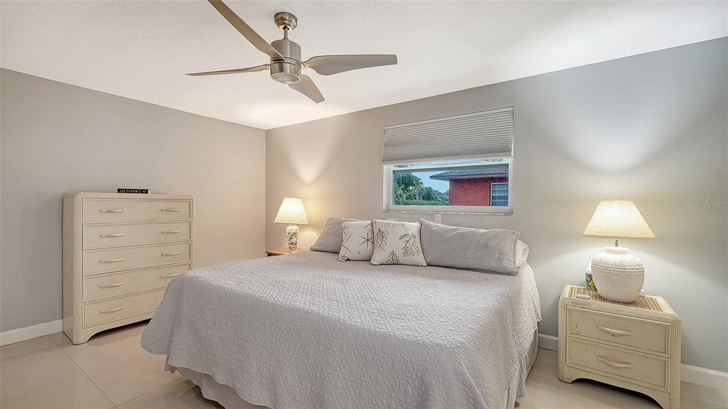 1523 84th Street Northwest Bradenton, FL 34209 - Photo 18 of 48 a bedroom with a bed and a lamp