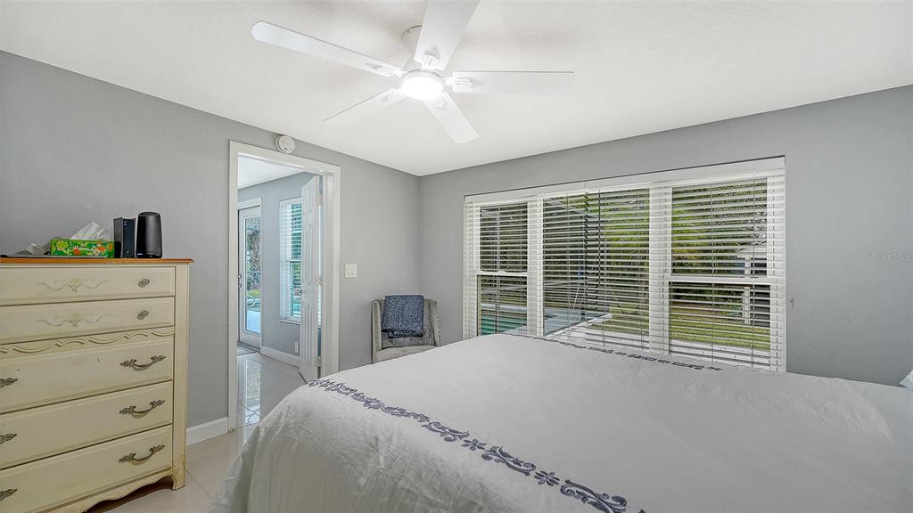 1523 84th Street Northwest Bradenton, FL 34209 - Photo 25 of 48 a bedroom with a large bed and a window
