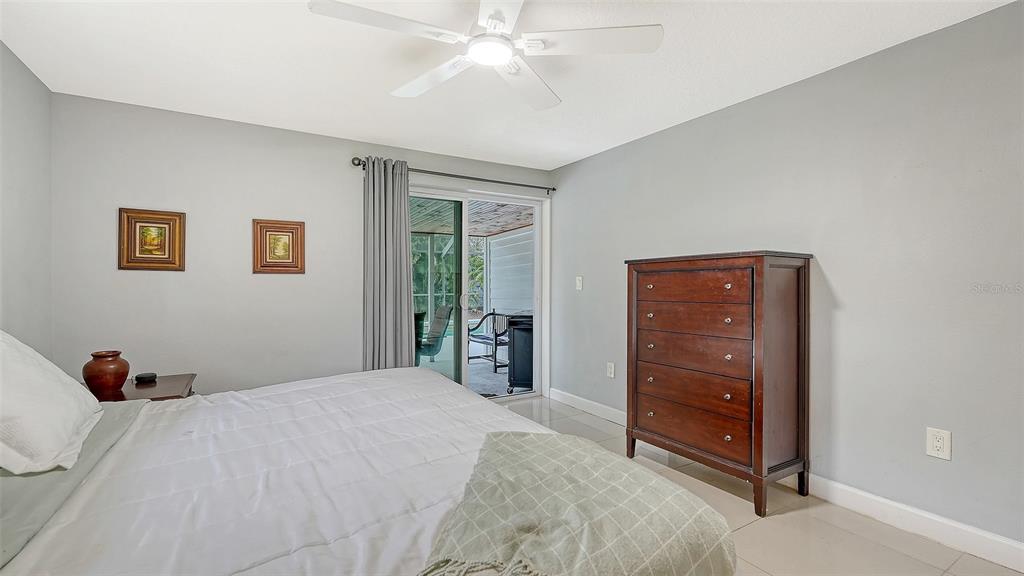 1523 84th Street Northwest Bradenton, FL 34209 - Photo 29 of 48 a bedroom with a bed and a chandelier