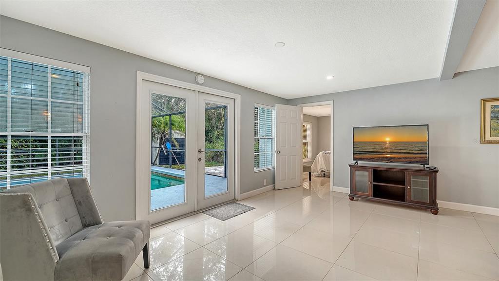 1523 84th Street Northwest Bradenton, FL 34209 - Photo 10 of 48 a living room with furniture windows and flat screen tv