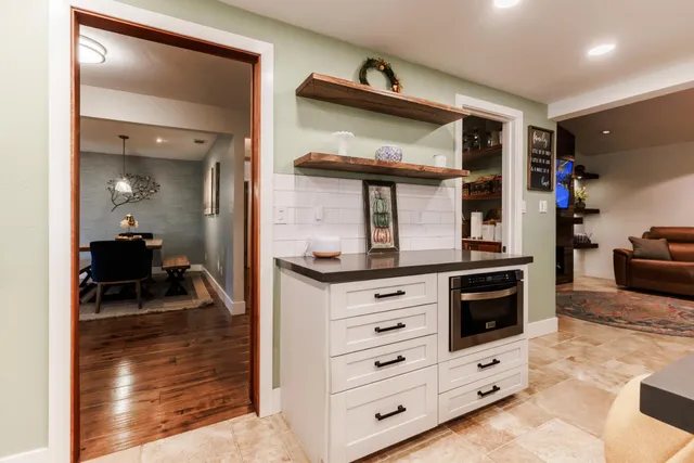 a view of living room kitchen and entryway