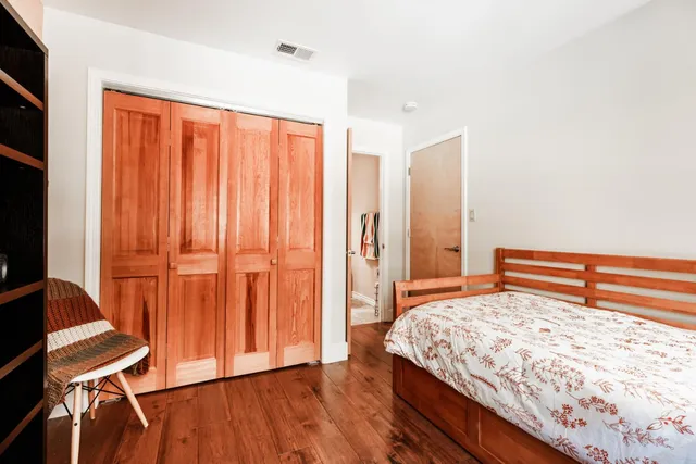 a bathroom with a toilet a sink and a mirror