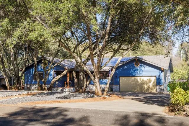 a view of a house with wooden fence