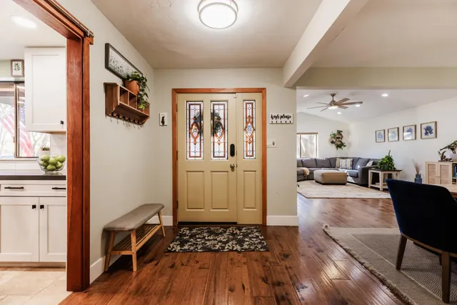 a living room with furniture and a rug