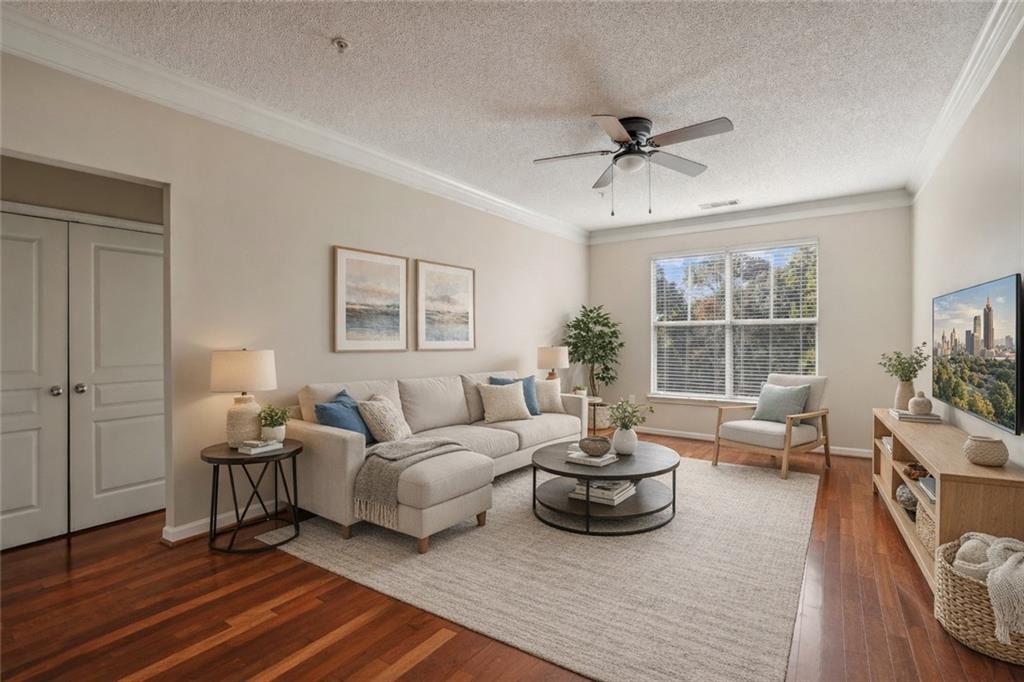 10 Perimeter Summit Boulevard, Unit 3206 Atlanta, GA 30319 - Photo 1 of 35 a living room with furniture and a large window