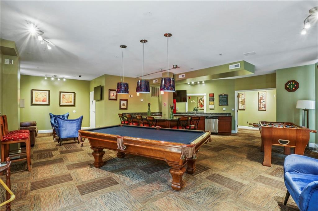 10 Perimeter Summit Boulevard, Unit 3206 Atlanta, GA 30319 - Photo 30 of 35 a room with lots of furniture and pool tables