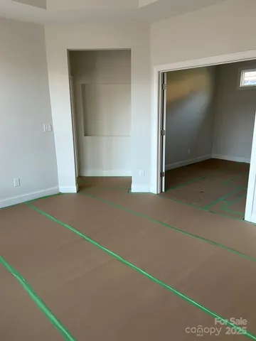 an empty room with an empty space and window