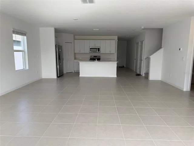 a view of a kitchen with a sink cabinets and a window
