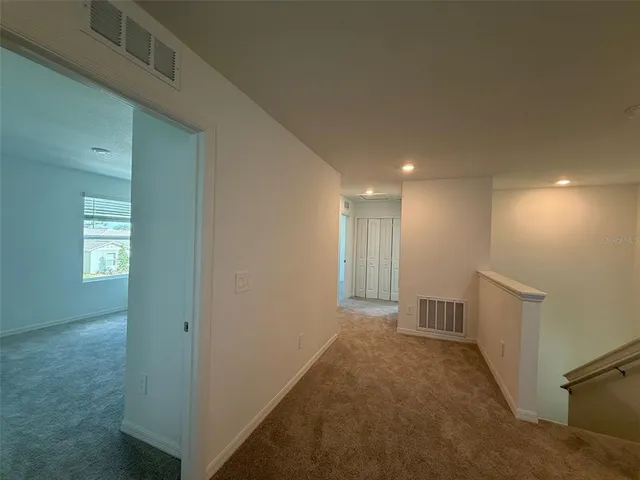 a view of hallway with livingroom