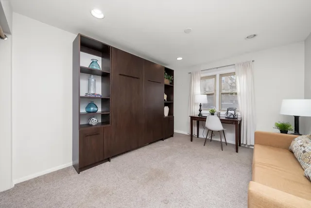 a view of a livingroom with furniture and window