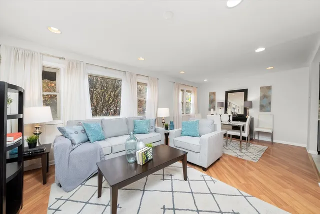 a living room with furniture and a table