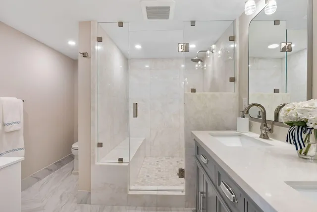a bathroom with a tub sink and mirror