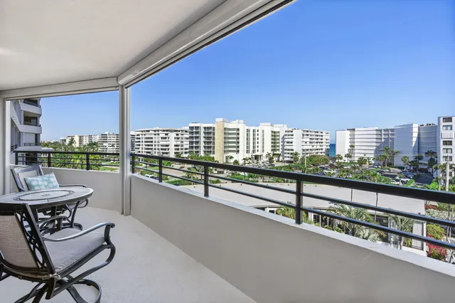 a view of a balcony with chairs