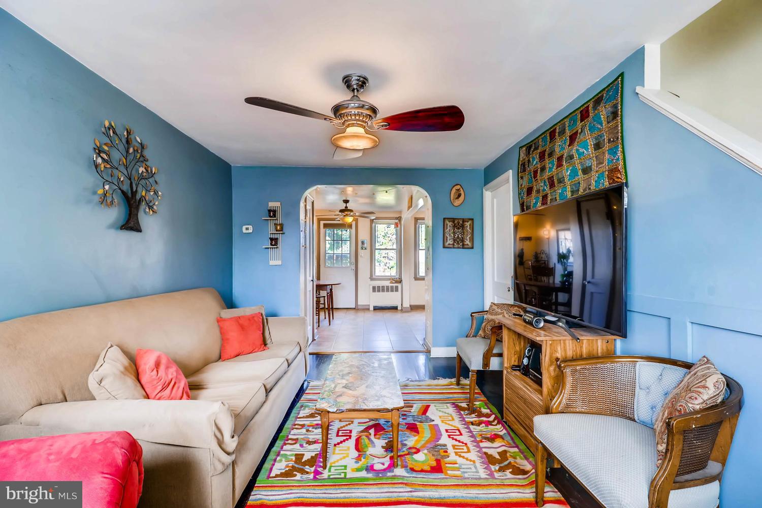 3703 Greenvale Road Baltimore, MD 21229 - Photo 2 of 24 a living room with furniture fireplace and a large window