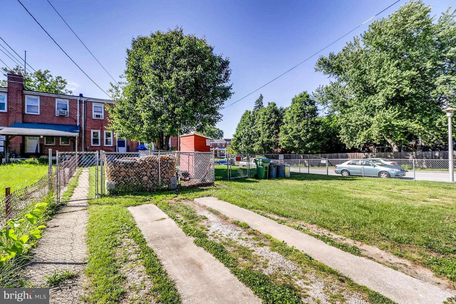 3703 Greenvale Road Baltimore, MD 21229 - Photo 24 of 24 a view of a house with a yard and sitting area
