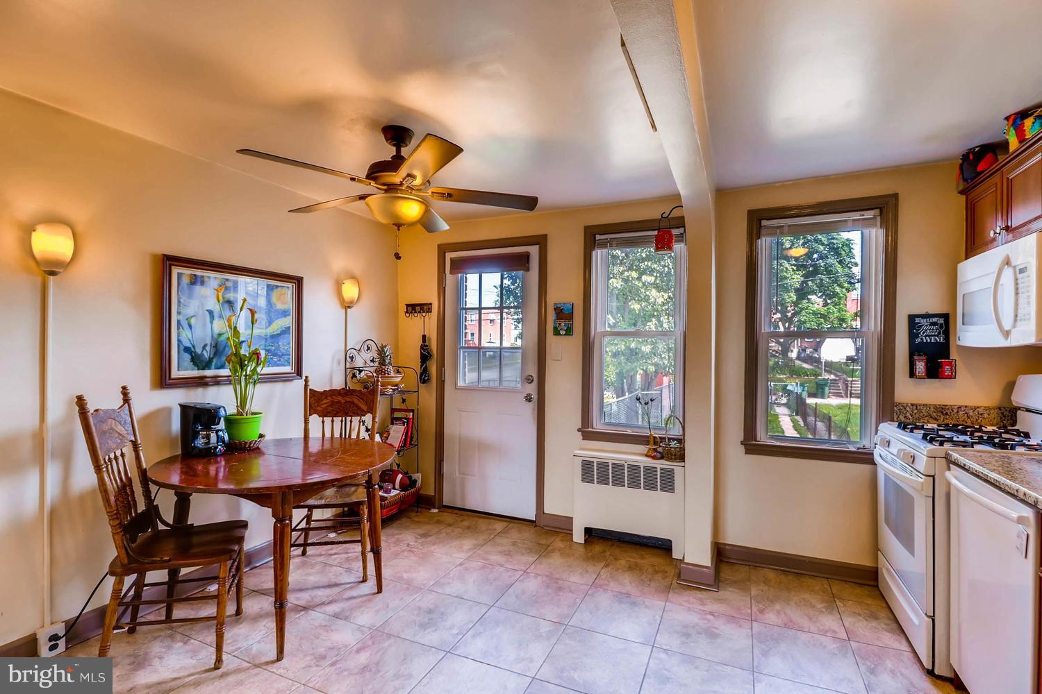 3703 Greenvale Road Baltimore, MD 21229 - Photo 10 of 24 a view of a dining room with furniture window and outside view