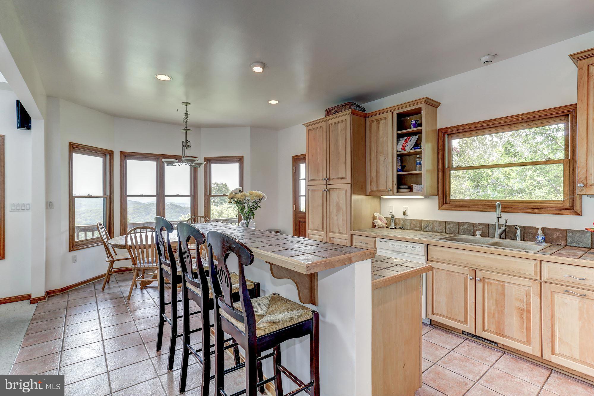 4615 Remount Road Huntly, VA 22640 - Photo 27 of 30 a kitchen with a table chairs sink and cabinets