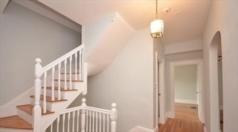 341 Summer Street, Unit 2F Somerville, MA 02144 - Photo 1 of 17 a view of a hallway with wooden floor and entryway