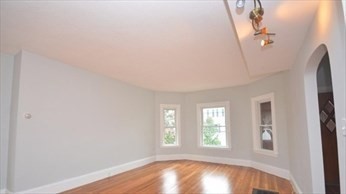 341 Summer Street, Unit 2F Somerville, MA 02144 - Photo 17 of 17 an empty room with windows