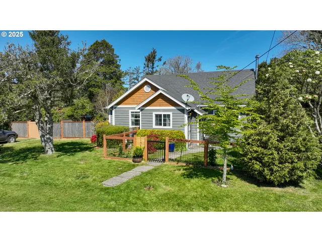 a view of an house with backyard space and garden