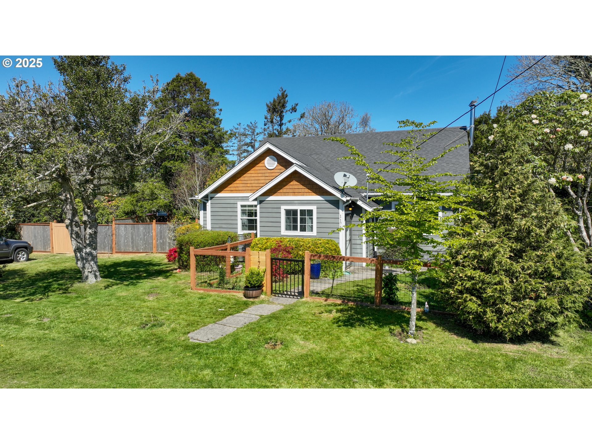 a view of an house with backyard space and garden