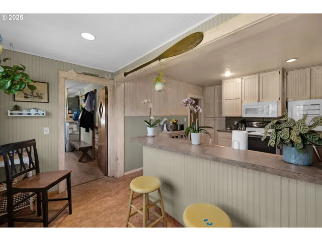 a kitchen with sink and refrigerator