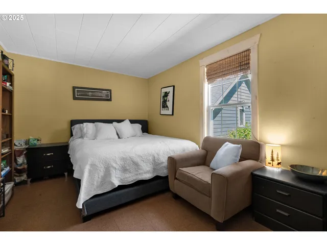 a bedroom with bed and window