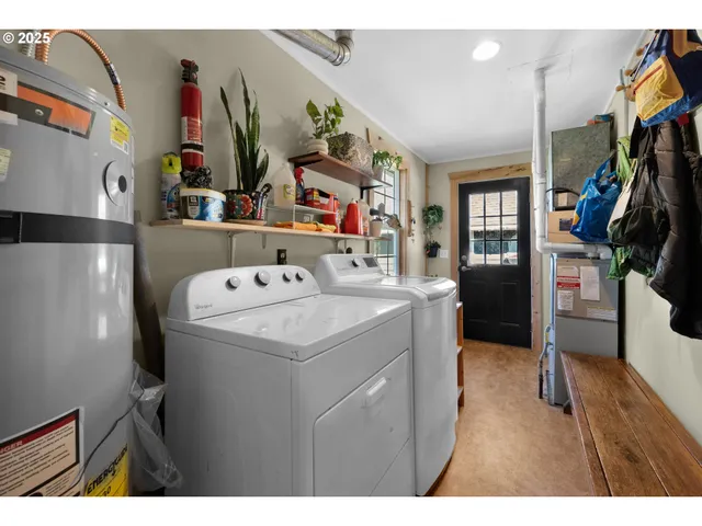 a utility room with washer and dryer