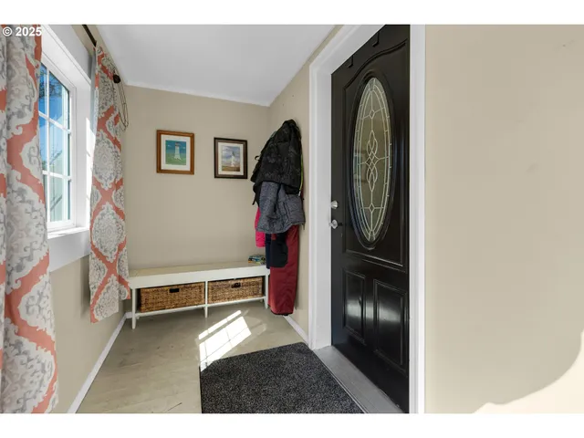 a view of livingroom with furniture and natural light