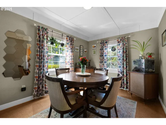 a view of a dining room with furniture and chandelier