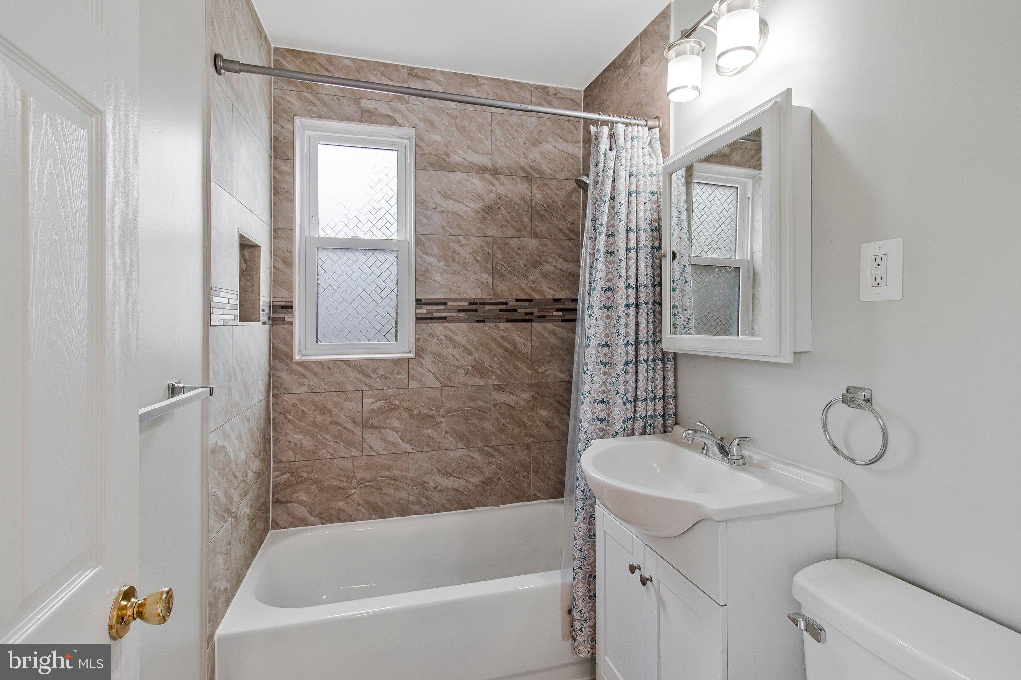 8600 Lantern Lane Clinton, MD 20735 - Photo 18 of 40 a bathroom with a sink toilet and shower