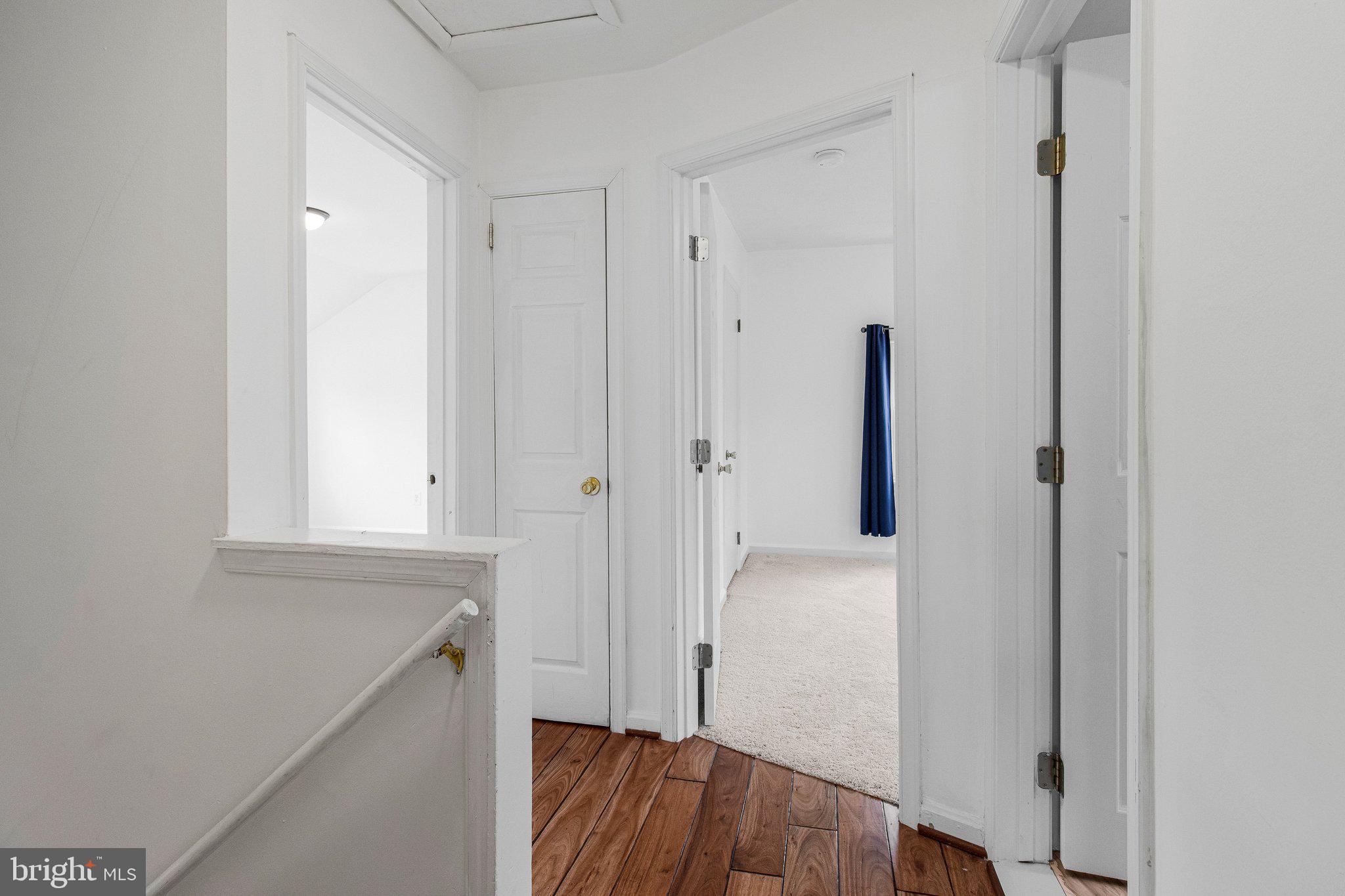 8600 Lantern Lane Clinton, MD 20735 - Photo 29 of 40 a view of hallway with wooden floor