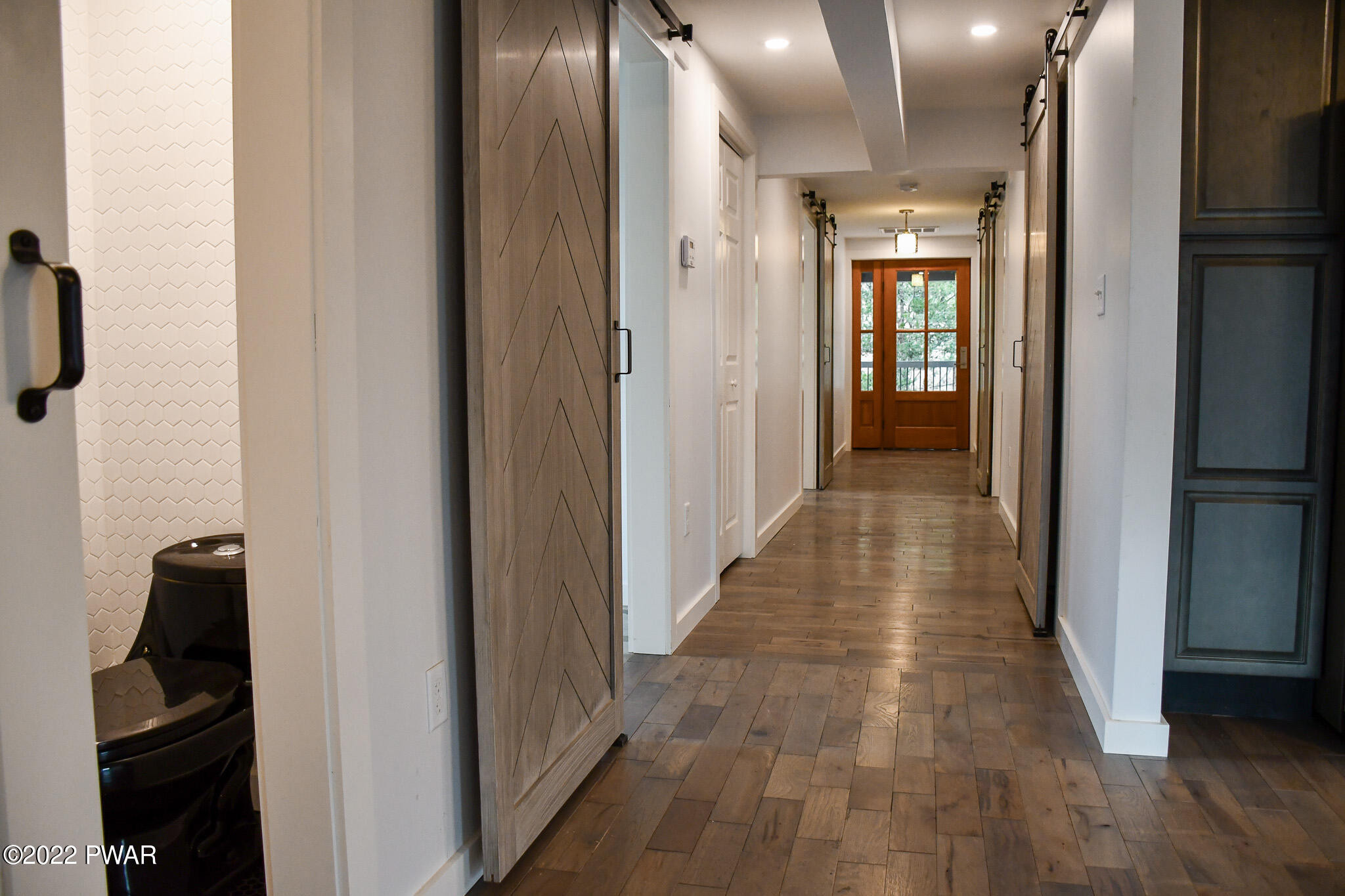 2 Hudson Street Hawley, PA 18428 - Photo 8 of 43 a view of a hallway with wooden floor