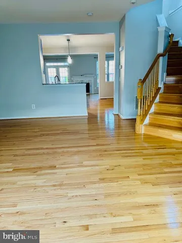 a view of a room with wooden floor