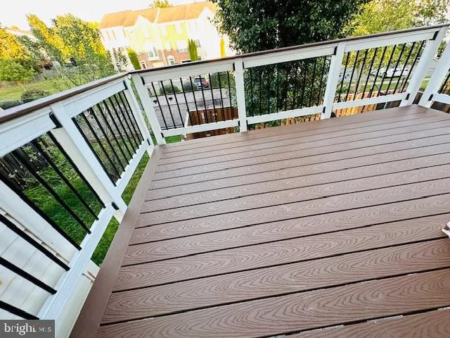 a view of balcony with wooden floor