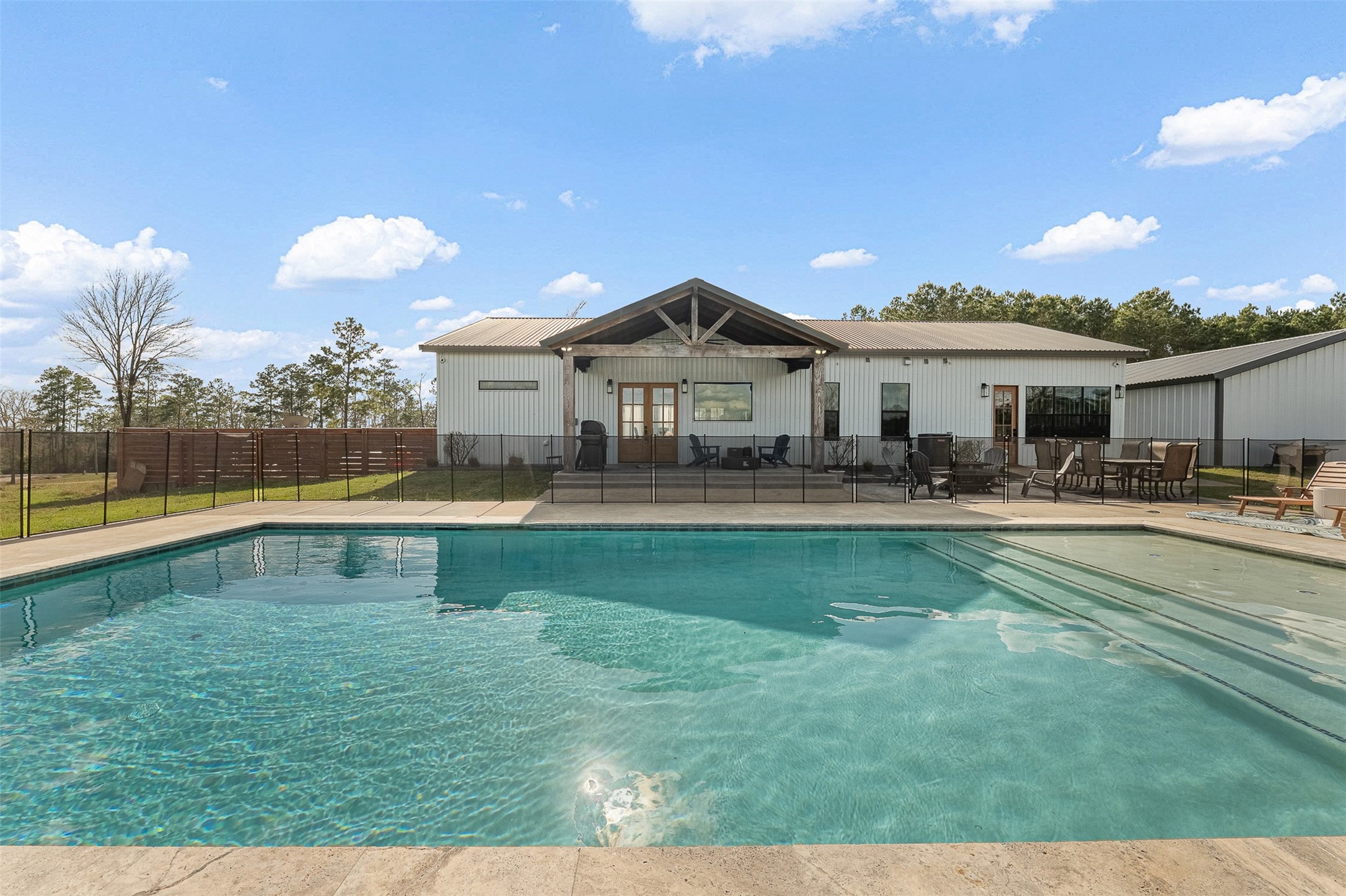 150 Bullyvard Livingston, TX 77351 - Photo 3 of 40 a front view of a house with swimming pool having outdoor seating