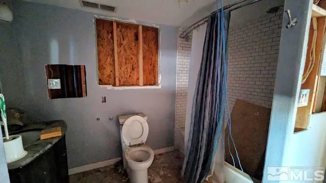 a bathroom with a toilet and a sink