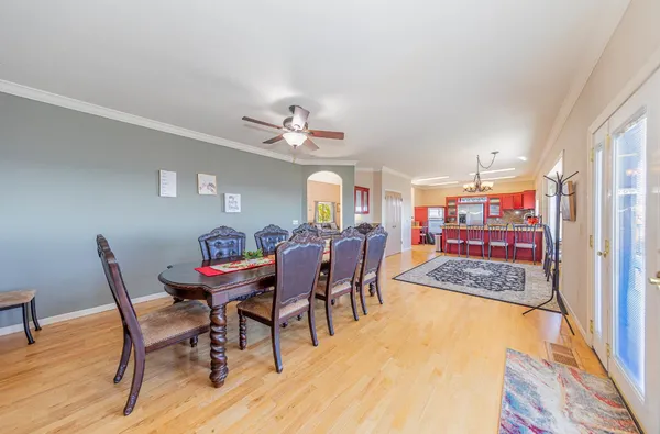 a kitchen with lots of counter top space and painting on the wall