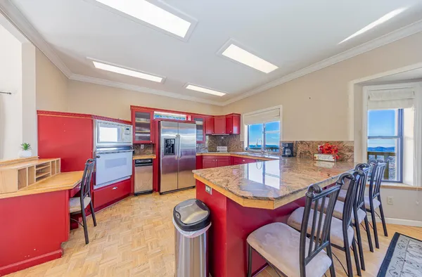 a dining room with furniture and wooden floor