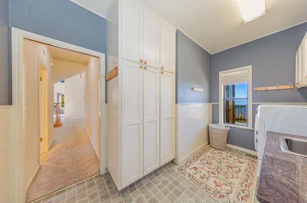 a spacious bathroom with double sink a large mirror and a