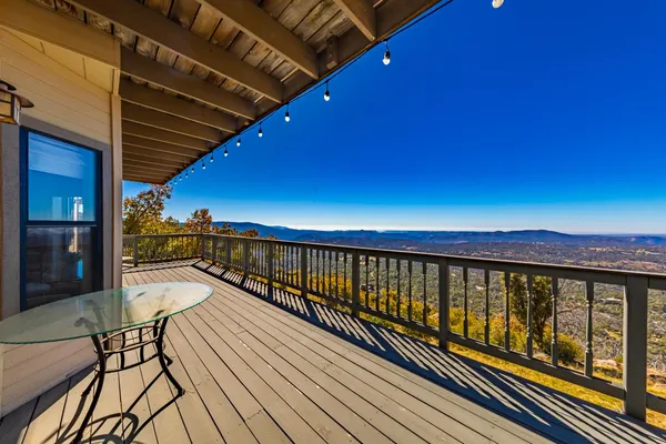 a kitchen that has a table and chairs in it