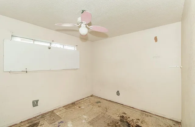 a bathroom with a bathtub and a toilet