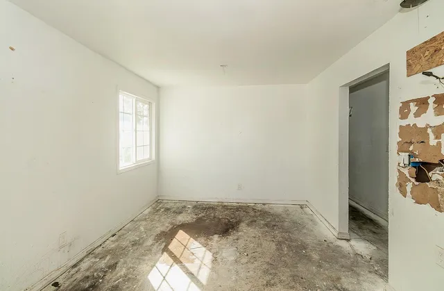 a view of a hallway with a room