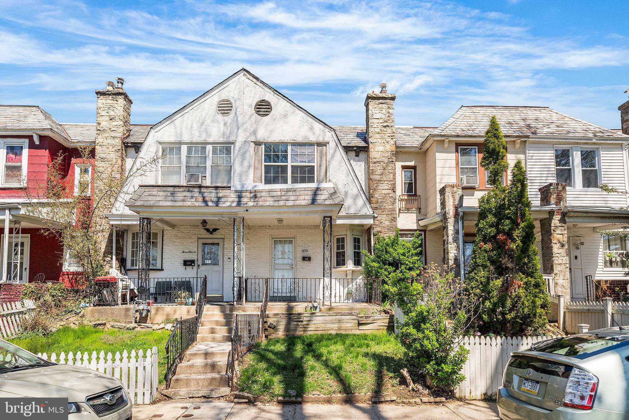 front view of a house with a yard