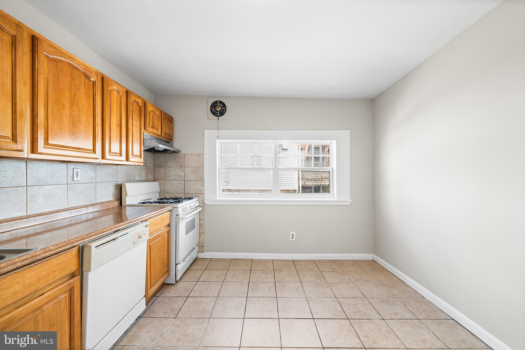 309 Sanford Road Upper Darby, PA 19082 - Photo 11 of 21 a kitchen with a sink cabinets and window
