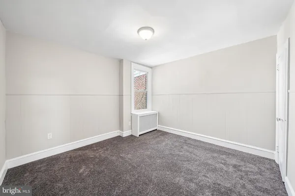 an empty room with a empty space and window