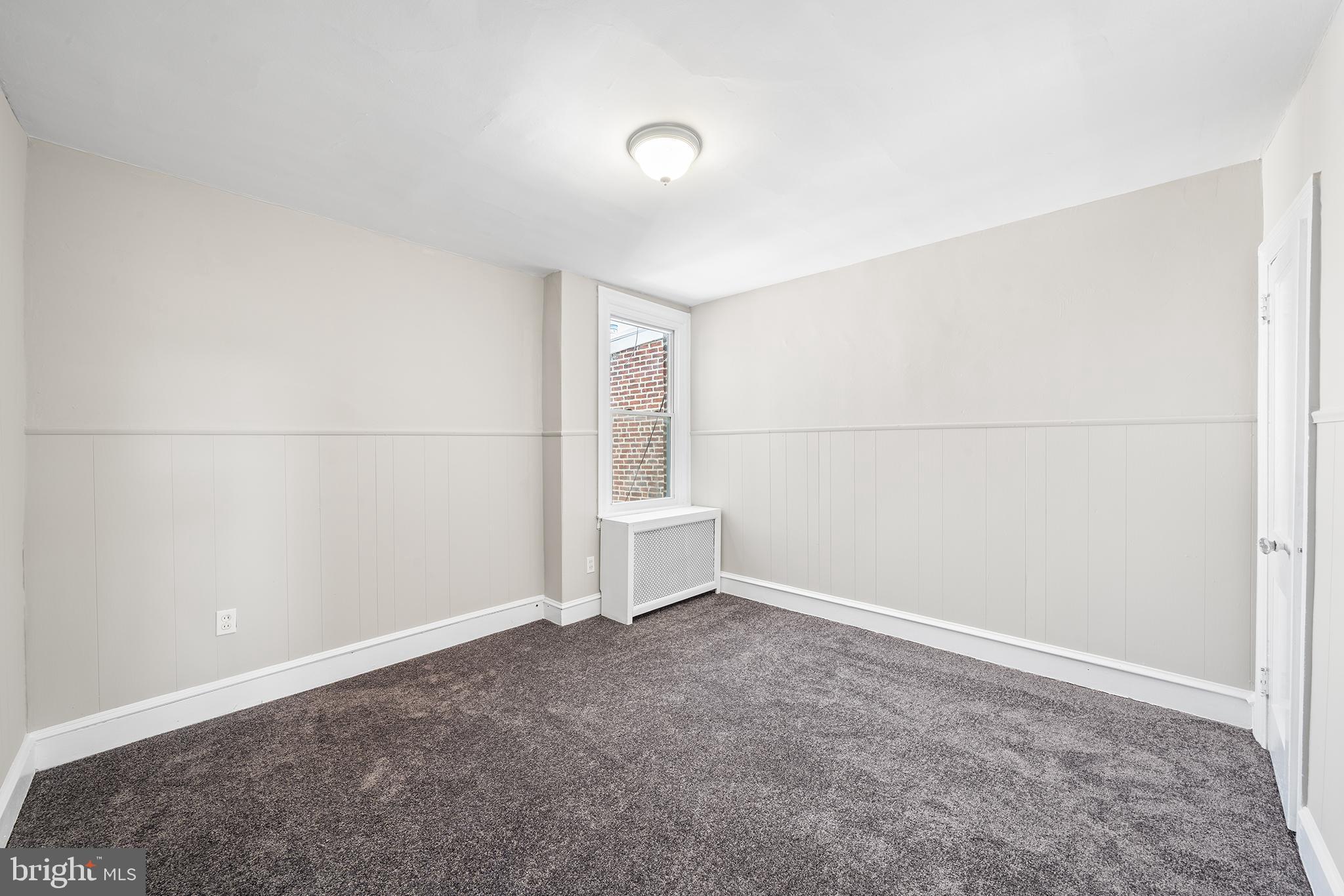 309 Sanford Road Upper Darby, PA 19082 - Photo 14 of 21 an empty room with a empty space and window