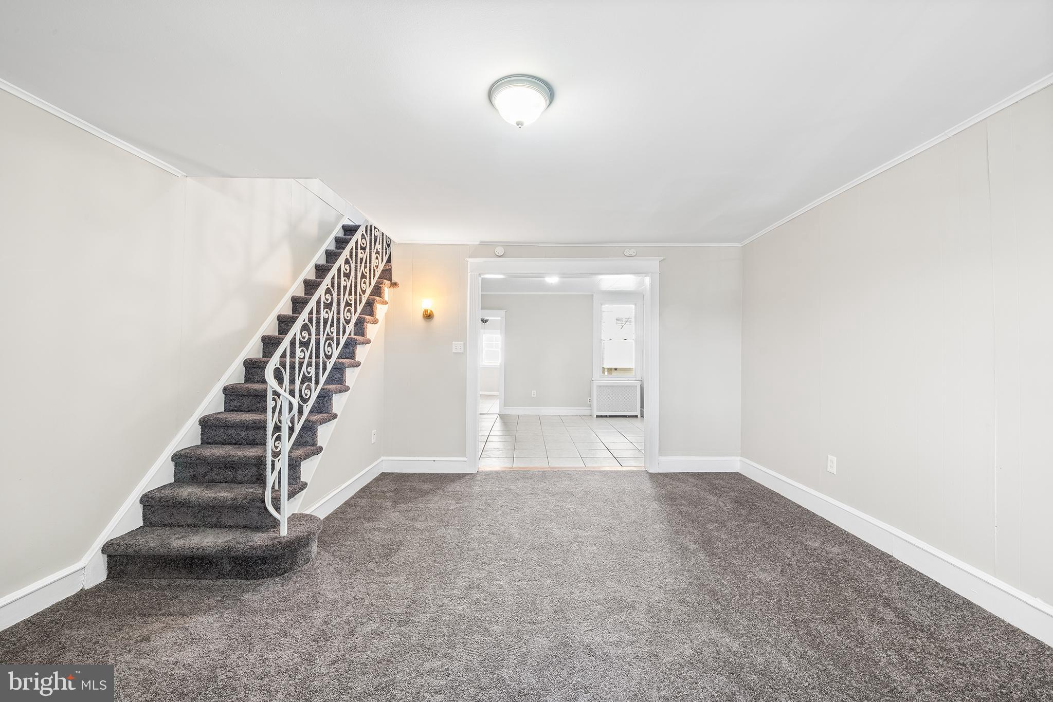 309 Sanford Road Upper Darby, PA 19082 - Photo 6 of 21 a view of an empty room with stairs