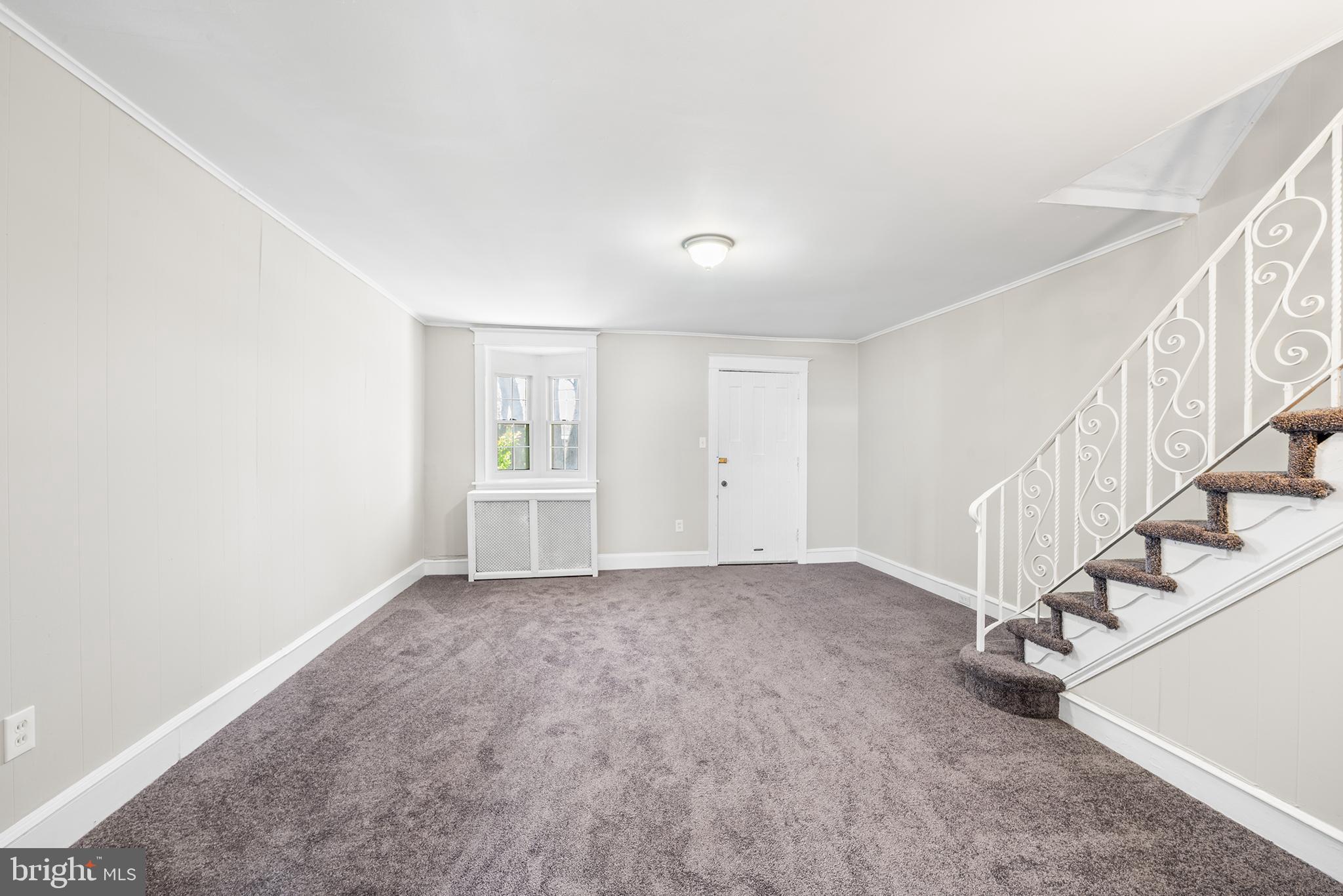 309 Sanford Road Upper Darby, PA 19082 - Photo 7 of 21 a view of an empty room with stairs